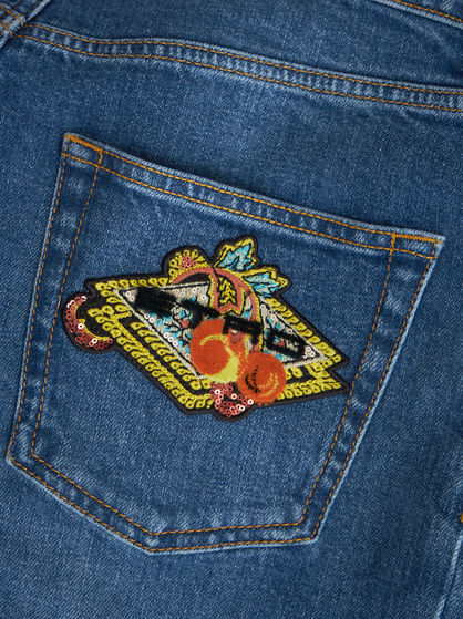 DENIM JEANS WITH EMBROIDERED PATCH
