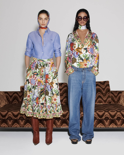 Two women wearing SS2024 collection in front of a sofa - link to new arrivals women