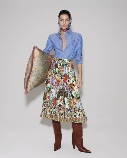 Woman wearing a blue etro shirt and a floreal printed skirt - link to woman's new arrivals 