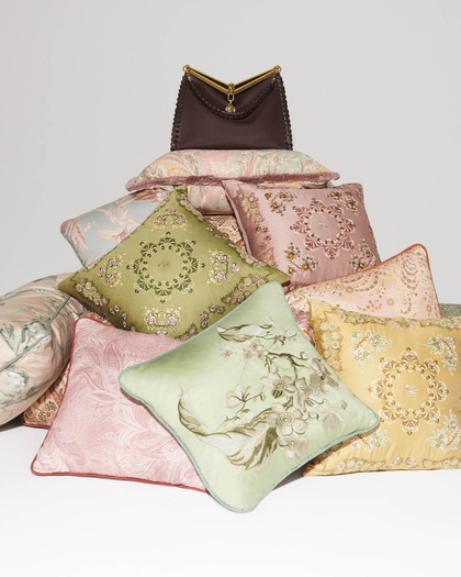 pic of a Vela bag on a pile of cushions - link to ETRO home collection