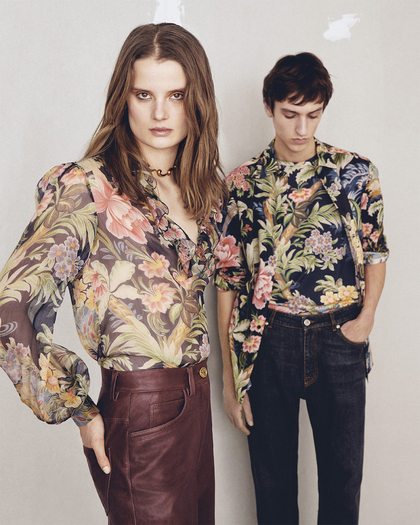 Woman and man wearing floral printed shirts