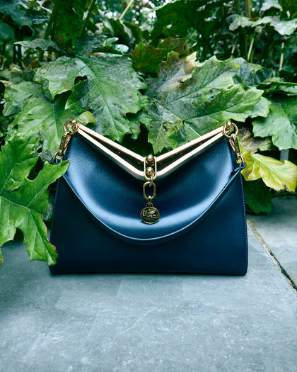 laminated blue mini vela bag Amidst the leaves