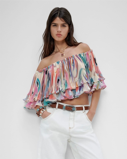 Woman wearing BUTTERFLY WING TOP WITH RUCHES, white jeans and top crown e jewels and belt - SS23 woman collection