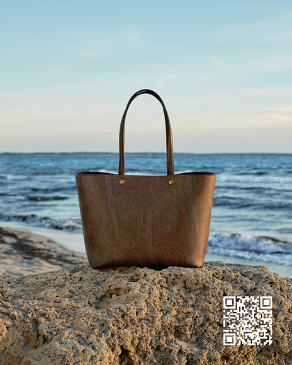 Etro Essential shopping bag in front of the sea and JD QR Code in the background