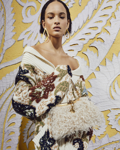 Model holding a MINI WOOL AND MOHAIR VELA BAG