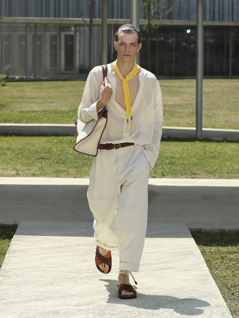 Etro Man Fashion Show SS23; Jacquard Shirt With Lace, Linen Trousers With Tucks accompanied by Leather Belt With Stitching and a yellow scarf