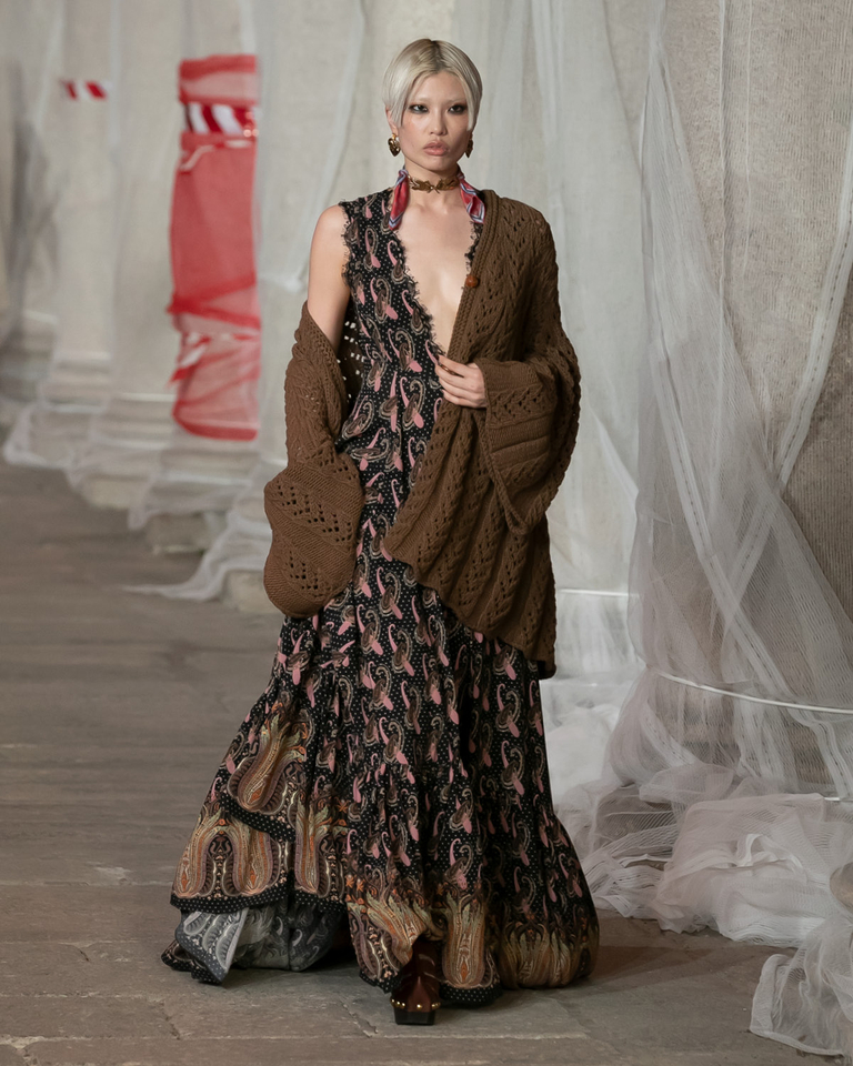 Model in multicoloured evening dress and cardigan on the Etro women's fall winter 2023 catwalk