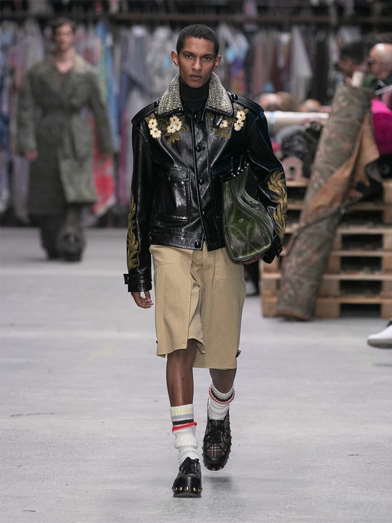Model with black leather jacket and shorts Etro fashion show fall winter collection 2023/2024