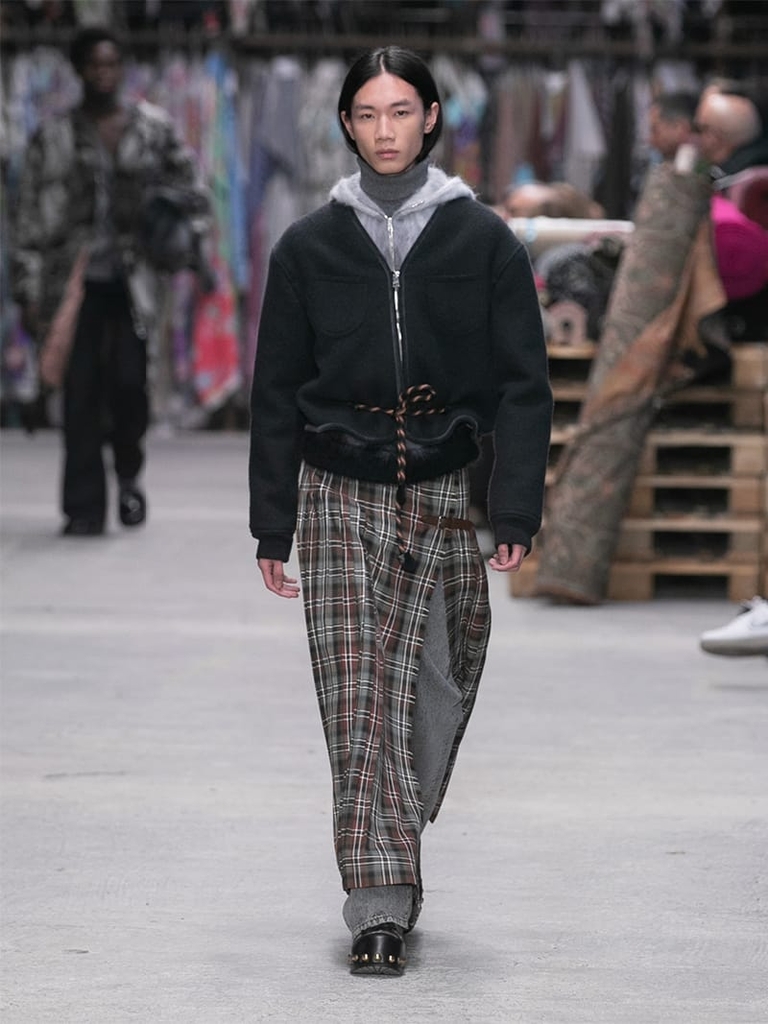 Model with black jacket and checked trousers Etro fashion show fall winter collection 2023/2024