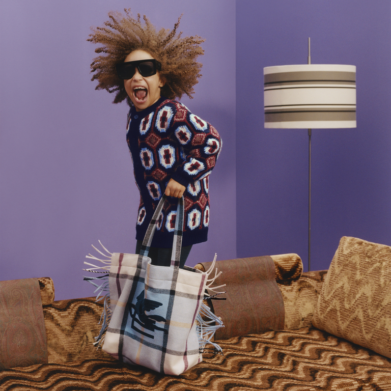 Young kid playing dressed up in Etro Kids SS24 collection