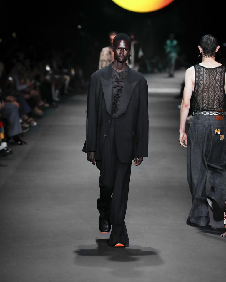 Model with elegant black suit and black transparent vest Etro Spring Summer collection 2024 fashion show