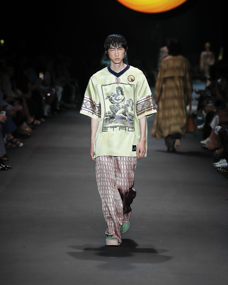 Model with green medium-sleeved T-shirt and long trousers with geometric patterns Etro Spring Summer collection 2024 fashion show