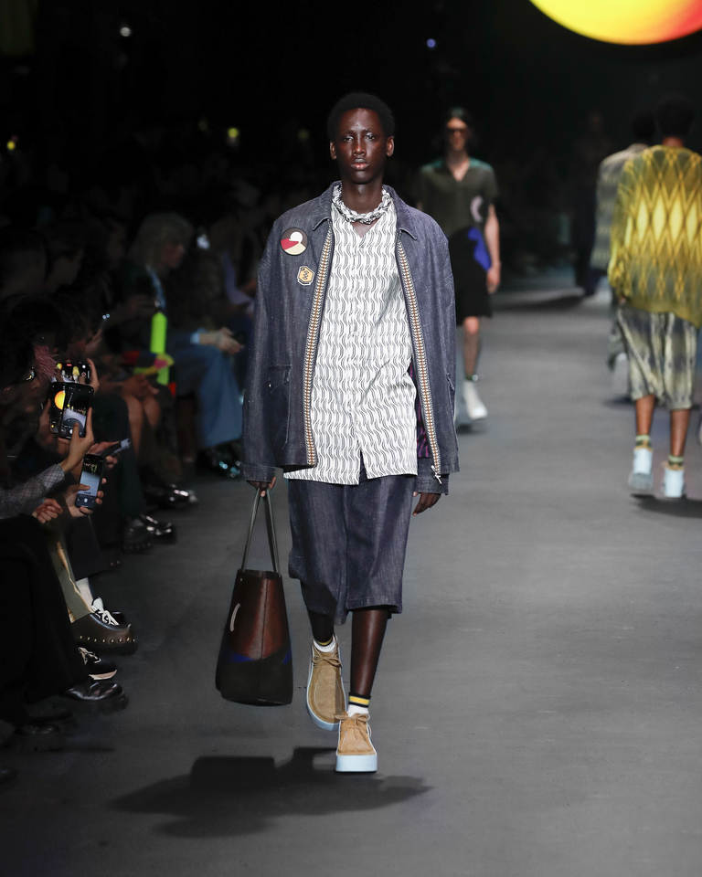 Model with denim jacket and short trousers, white shirt and scarf Etro Spring Summer collection 2024 fashion show