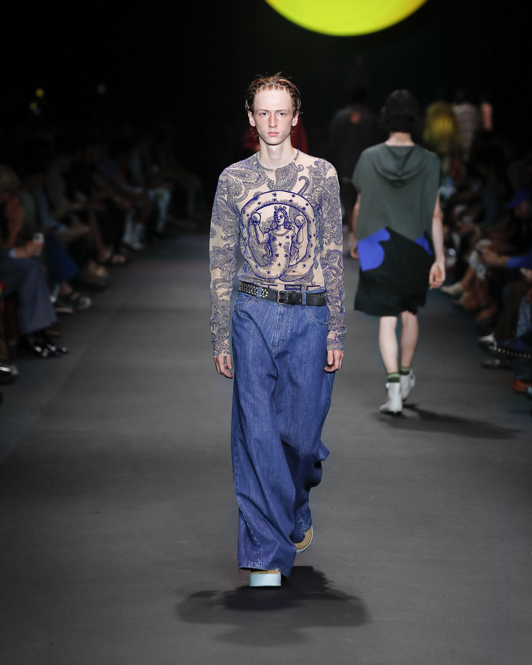 Model with transparent long-sleeved T-shirt and long jeans Etro Spring Summer collection 2024 fashion show
