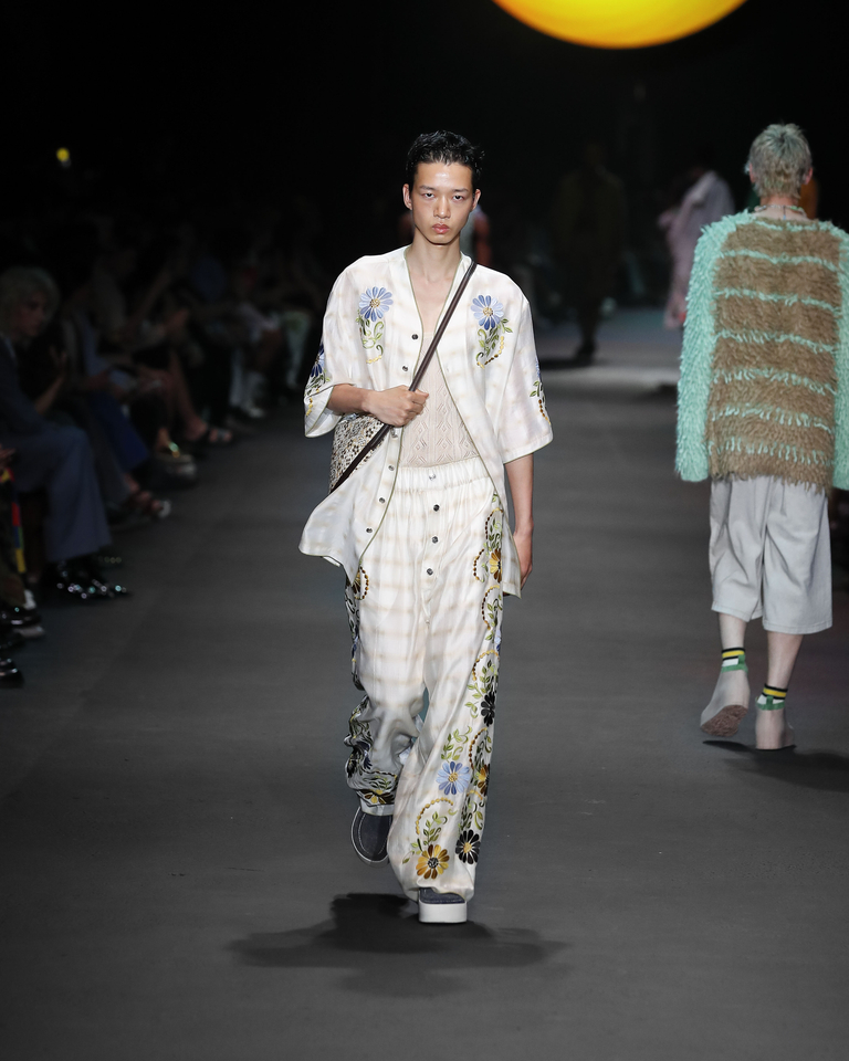 Model with shirt and long trousers with floral patterns, transparent vest and shoulder bag Etro Spring Summer collection 2024 fashion show