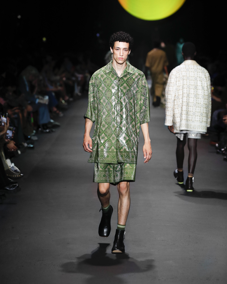 Model with long green shirt with mosaic patterns and short green shorts Etro Spring Summer collection 2024 fashion show